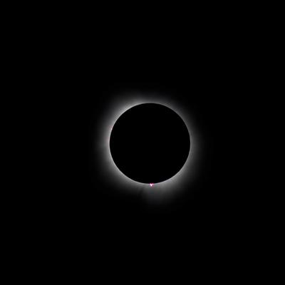 The eclipse on April 8, 2024 as seen from Malvern, Arkansas
in the United States. There are visible prominences on the
upper left and bottom, and the upper left prominence is 
probably a flare at this point.
